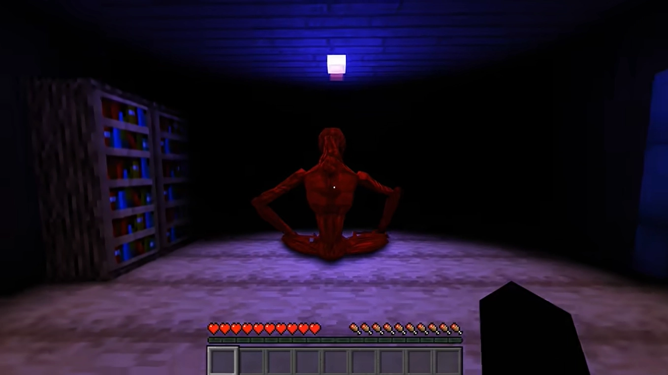 Twixxel's dream: a red figure sitting in a dark room